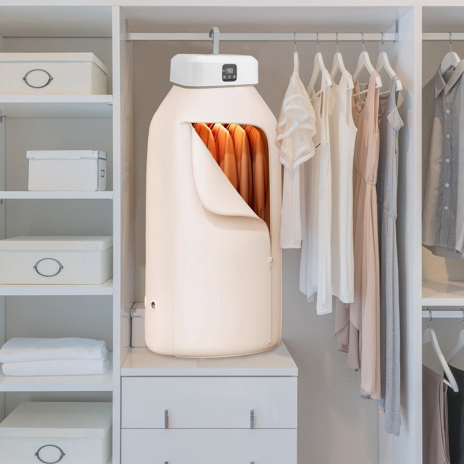 Clothing dryer in a closet with hanging clothes and shelves.