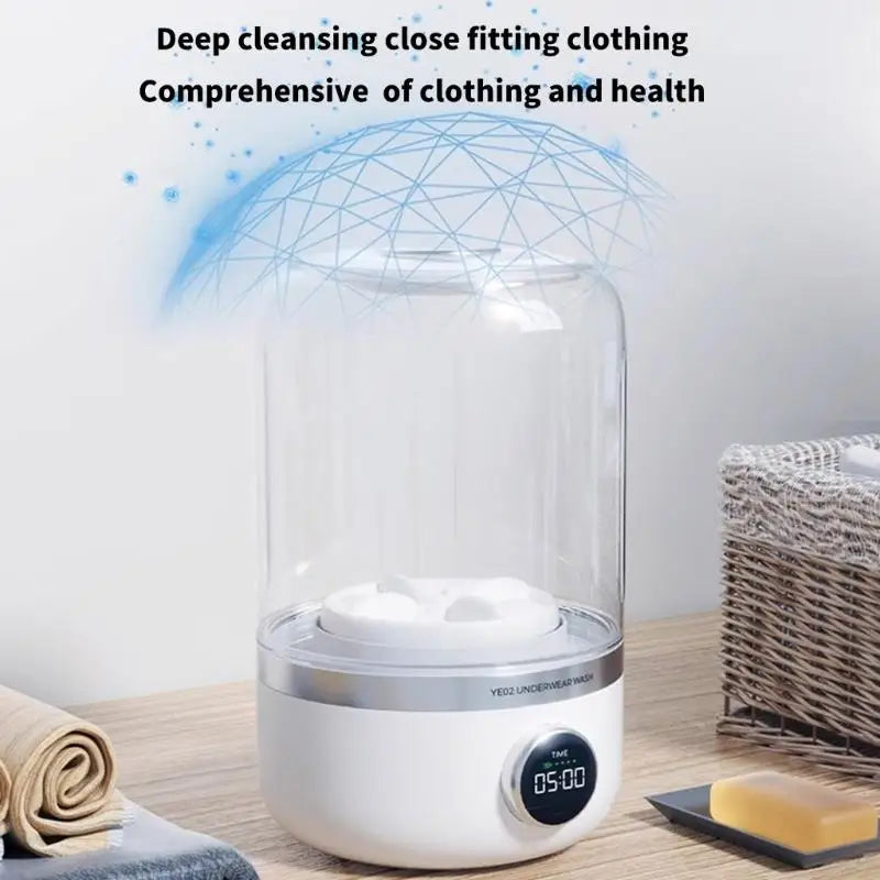 White appliance with digital display on a wooden surface, surrounded by towels and soap.
